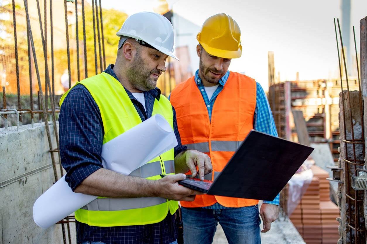 Field engineer using mobile phone on site